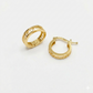 Gold hoop earrings on a white background