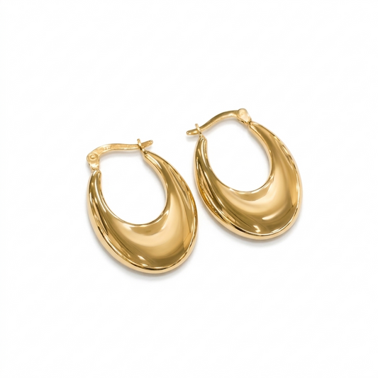 Gold hoop earrings on a white background