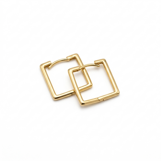 Gold hoop earrings on a white background