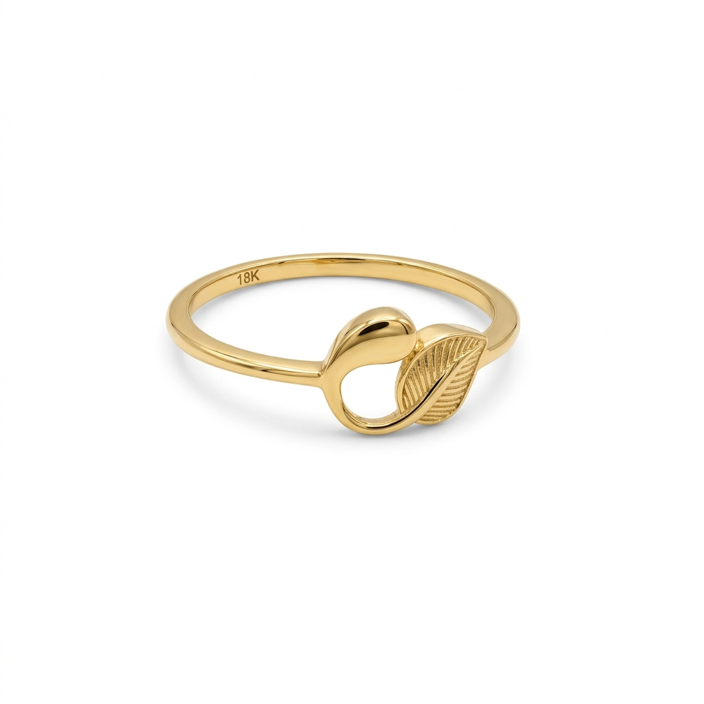 Gold ring with leaf design on a white background