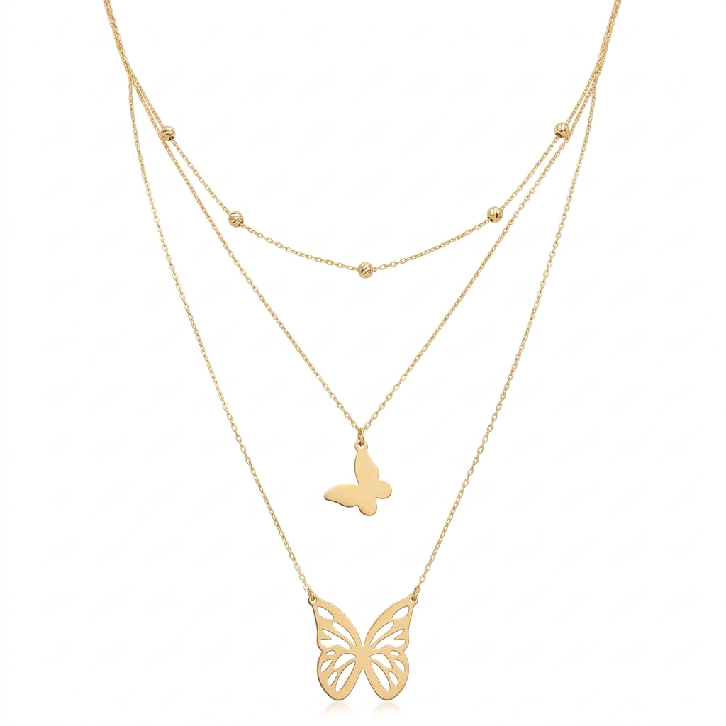 Gold butterfly necklace on a white background