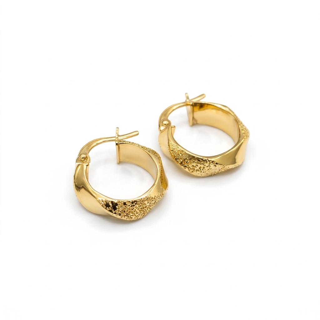 Gold hoop earrings on a white background