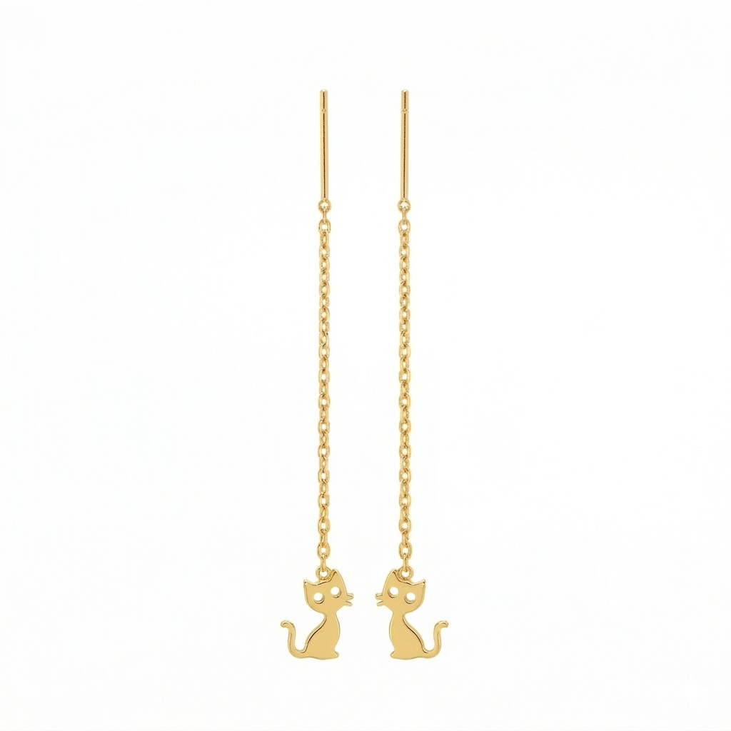 Gold cat-shaped earrings on thin chains against a white background