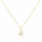 Gold necklace with a single pearl pendant on a white background