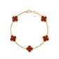 Gold bracelet with red clover-shaped charms on a white background