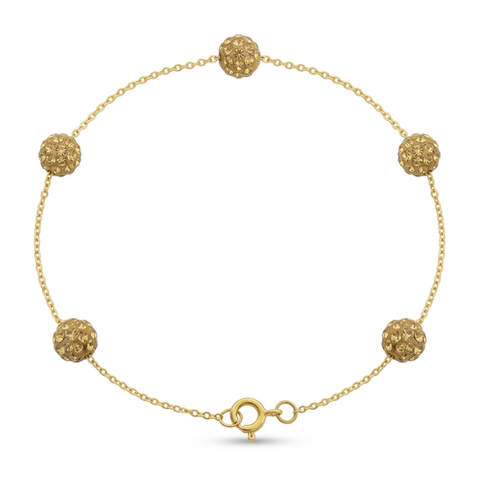 Gold bracelet with spherical beads on a white background