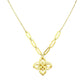 Gold necklace with a floral pendant on a white background