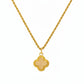 Gold necklace with a four-leaf clover pendant on a white background