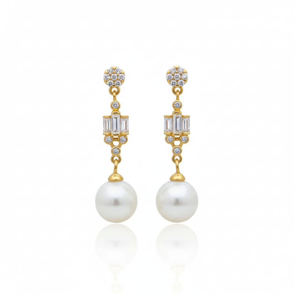 Gold earrings with pearls and gemstones on a white background