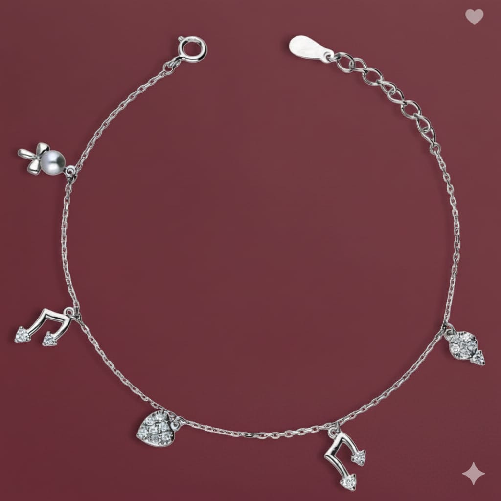 Silver bracelet with charms on a maroon background