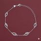 Silver bracelet with leaf-shaped links on a maroon background