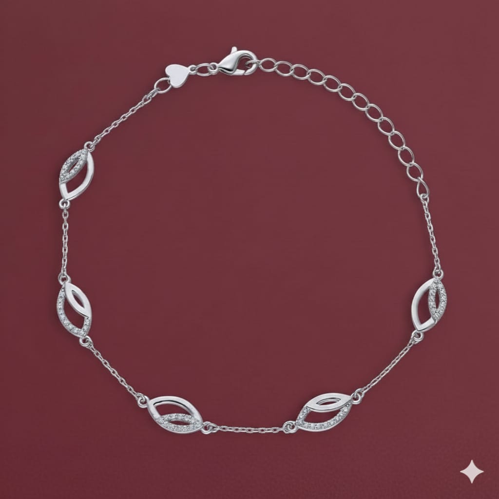 Silver bracelet with leaf-shaped links on a maroon background