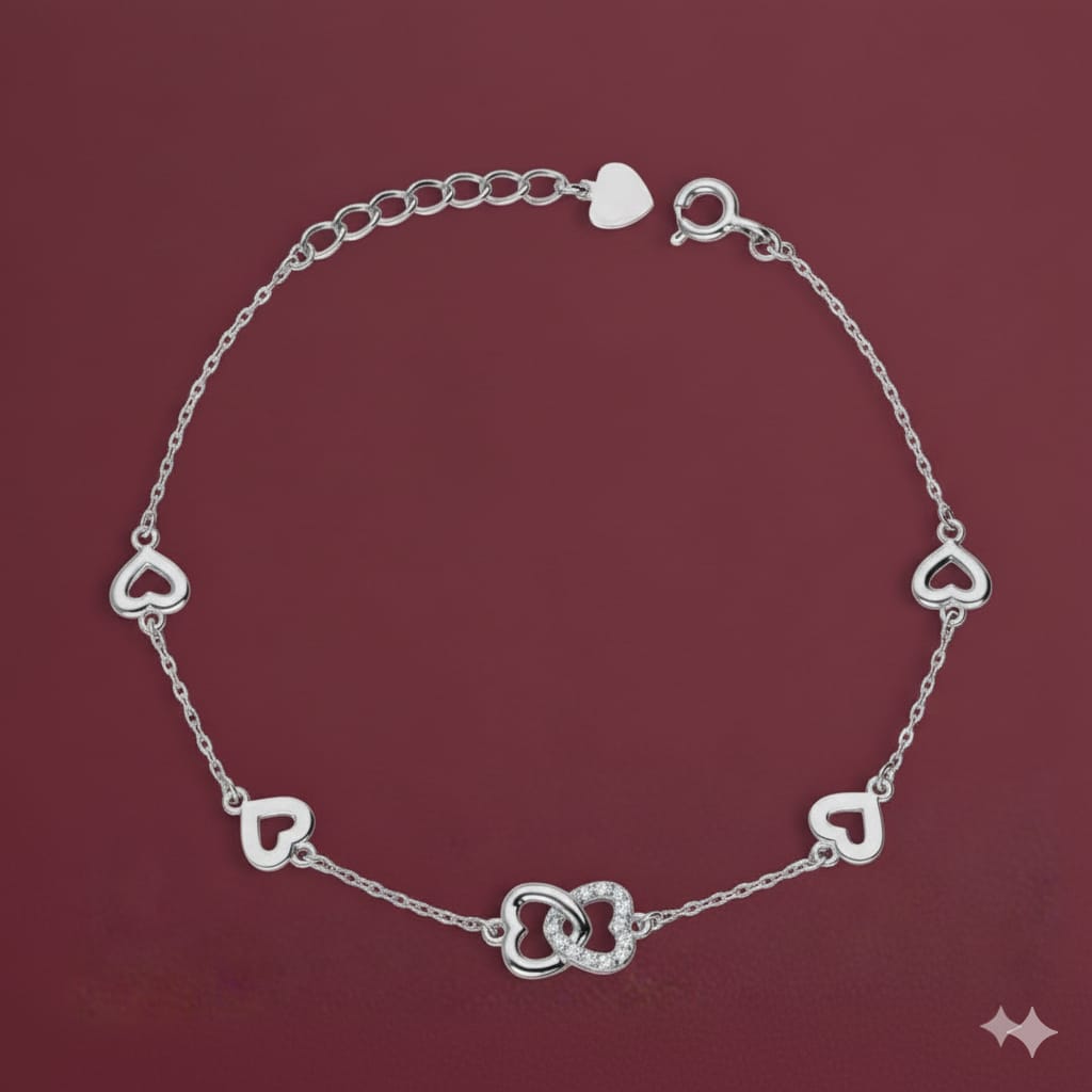 Silver heart-shaped bracelet on a red background