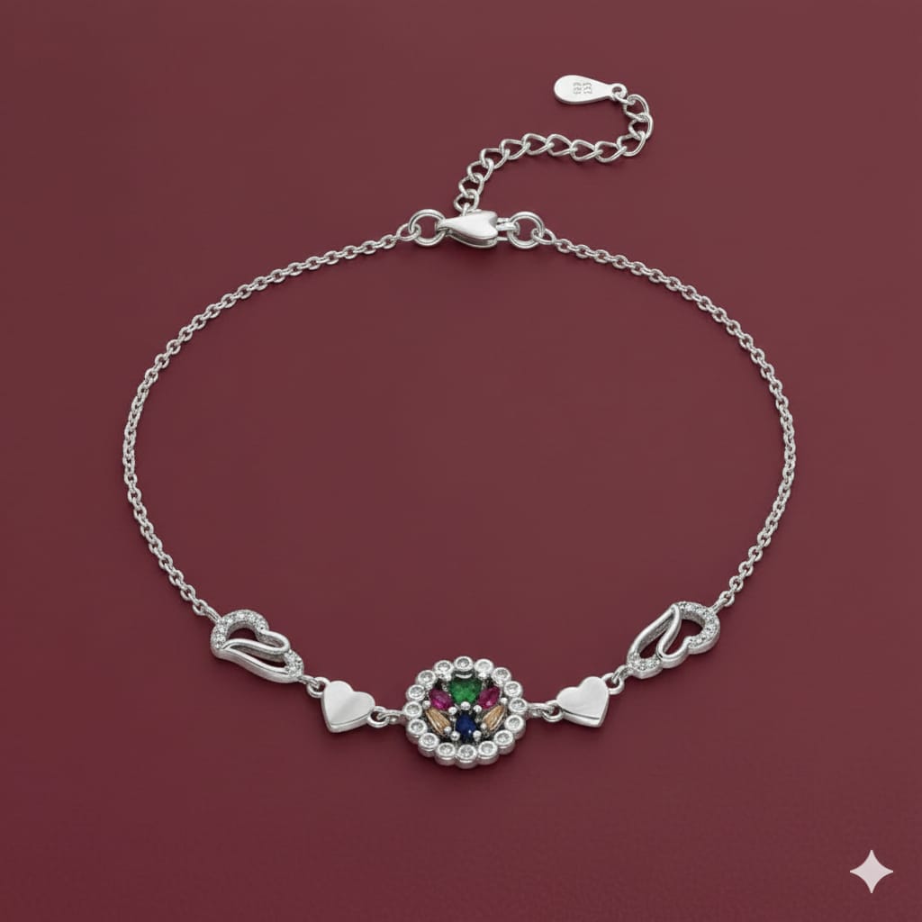 Silver bracelet with a decorative clasp on a red background