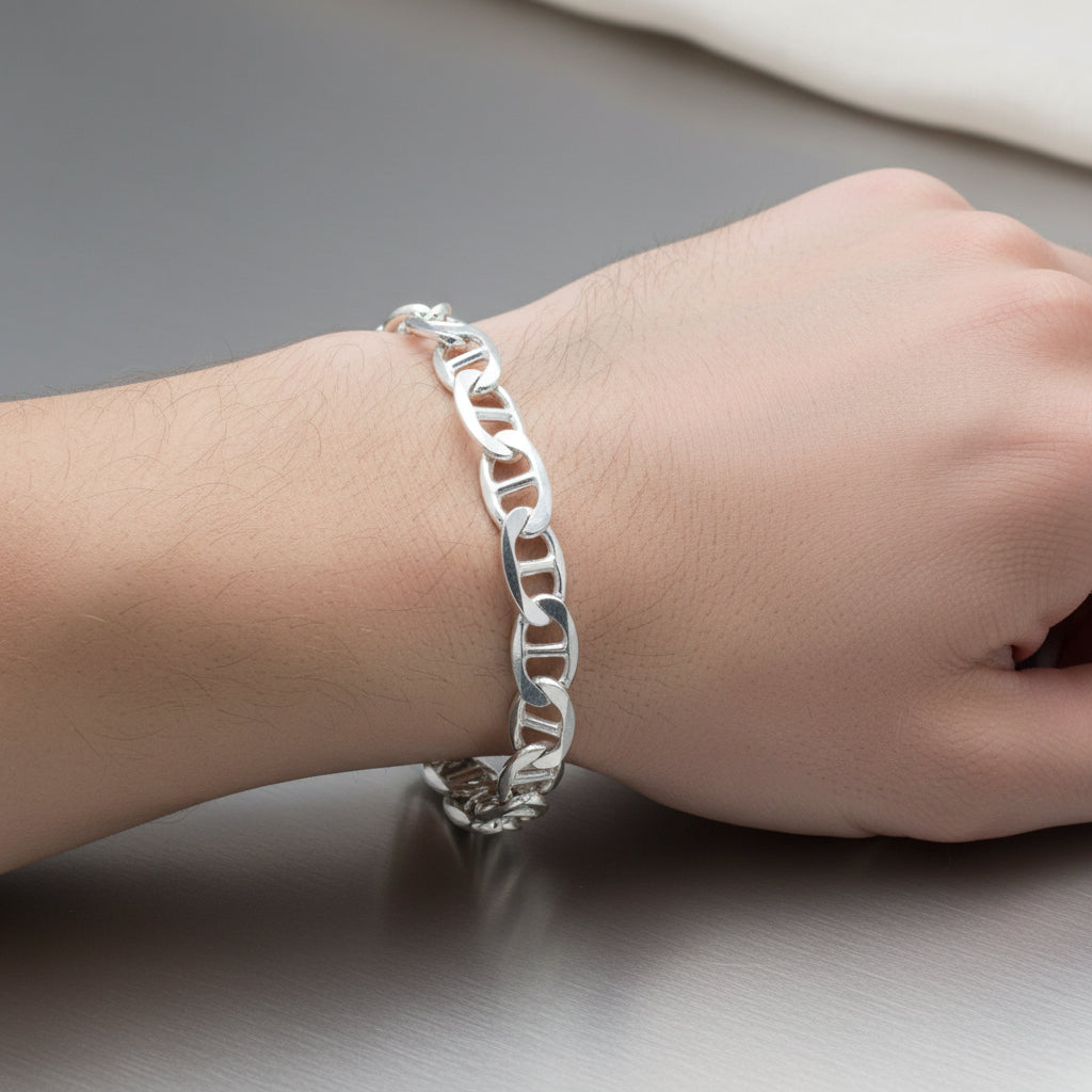 Silver chain bracelet on a red background