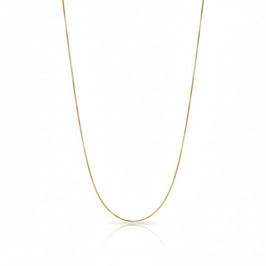 Gold chain necklace on a white background