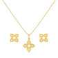 Gold necklace with matching earrings on a white background