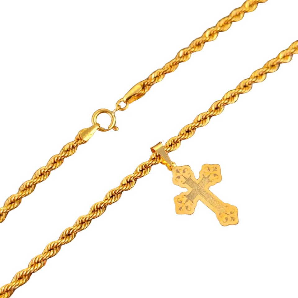 Gold necklace with a cross pendant on a black background