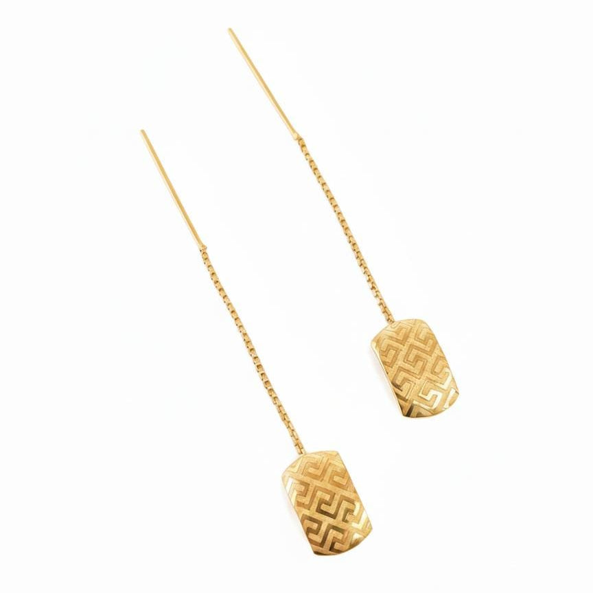 Gold necklace with two textured pendants on a white background
