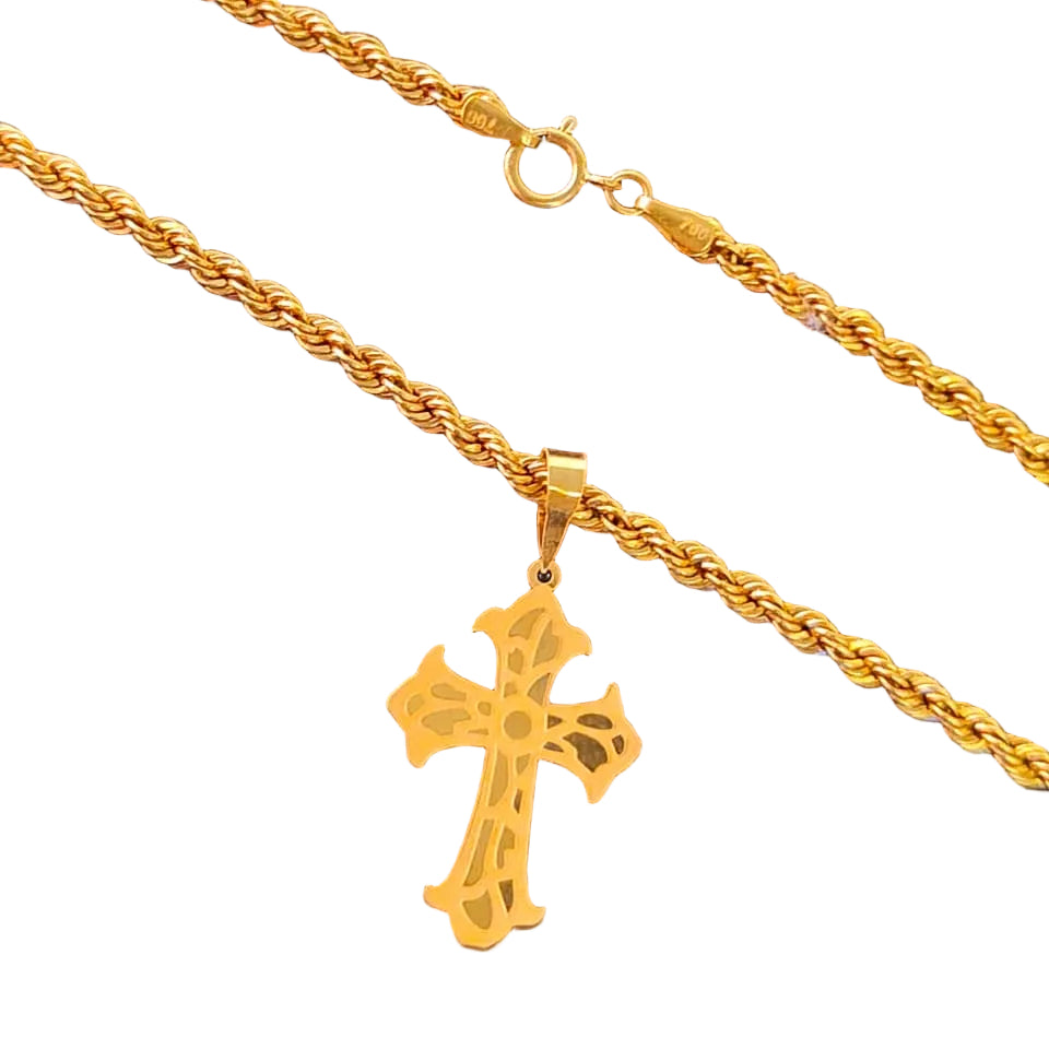 Gold necklace with a cross pendant on a black background