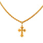 Gold necklace with a cross pendant on a black background