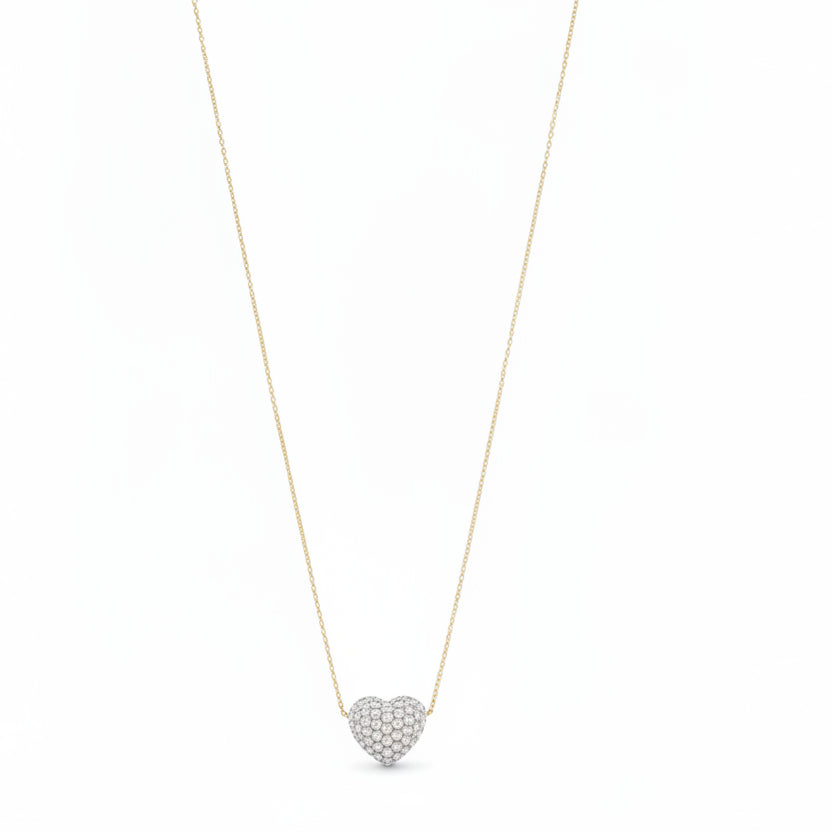 Necklace with a heart-shaped pearl pendant on a mannequin bust against a white background