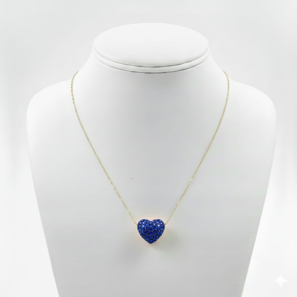 Necklace with a blue heart-shaped pendant on a mannequin bust against a white background