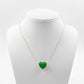 Necklace with a green heart-shaped pendant on a mannequin bust against a white background