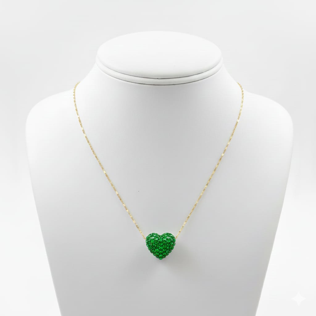 Necklace with a green heart-shaped pendant on a mannequin bust against a white background