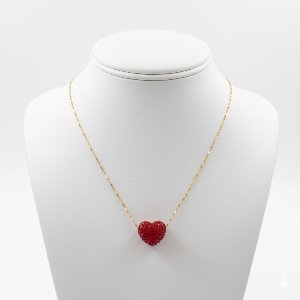 Necklace with a red heart pendant on a mannequin bust against a white background