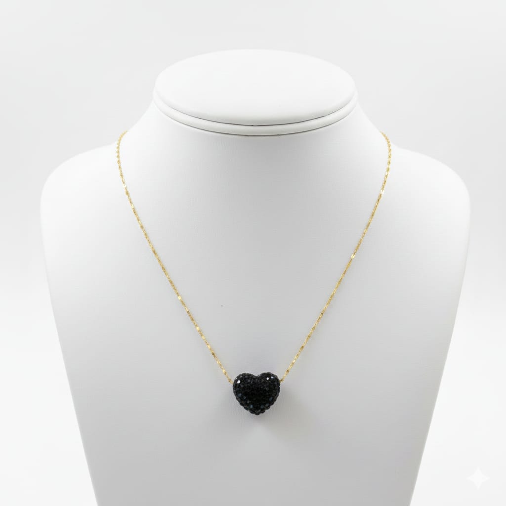 Necklace with a black heart-shaped pendant on a mannequin bust against a white background