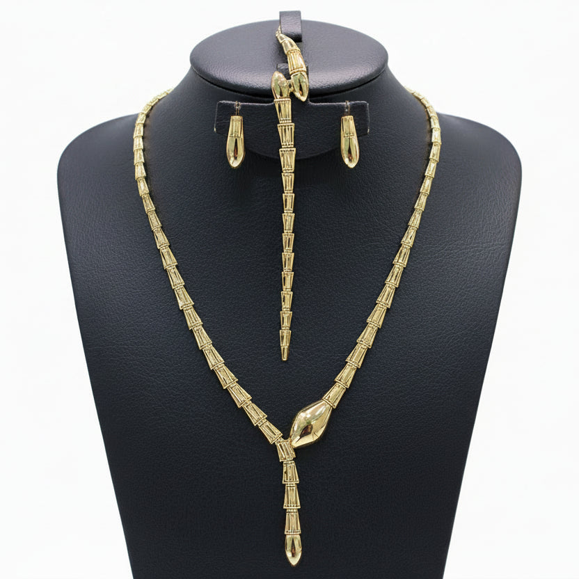 Gold necklace, bracelet, earrings, and ring set on a black mannequin with weight details.