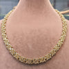 Gold chain necklace on a person's neck with measurements displayed.