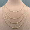 Gold chain necklace on a mannequin with measurements displayed.