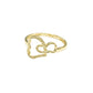 Gold ring with a heart design on a gray background