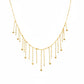 Delicate gold necklace on a mannequin with weight and code information.