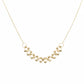 Gold necklace on a mannequin with weight label