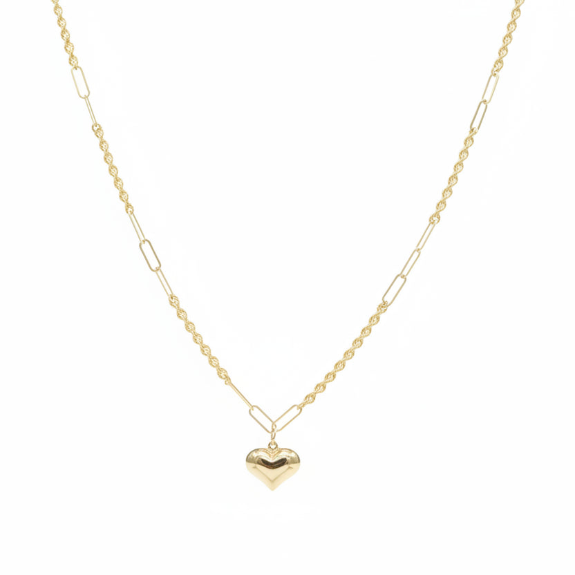 Gold necklace with a heart pendant on a mannequin neck, showing weight and code.