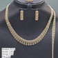 Gold necklace, bracelet, and earrings on a black mannequin with weight labels.