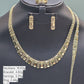 Gold necklace, bracelet, earrings, and ring on a black mannequin with weight information displayed.
