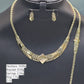 Gold necklace, bracelet, earrings, and ring on a black stand with weight details.