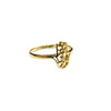Gold ring with intricate design on a light gray background