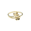 Gold ring with floral design on a gray background