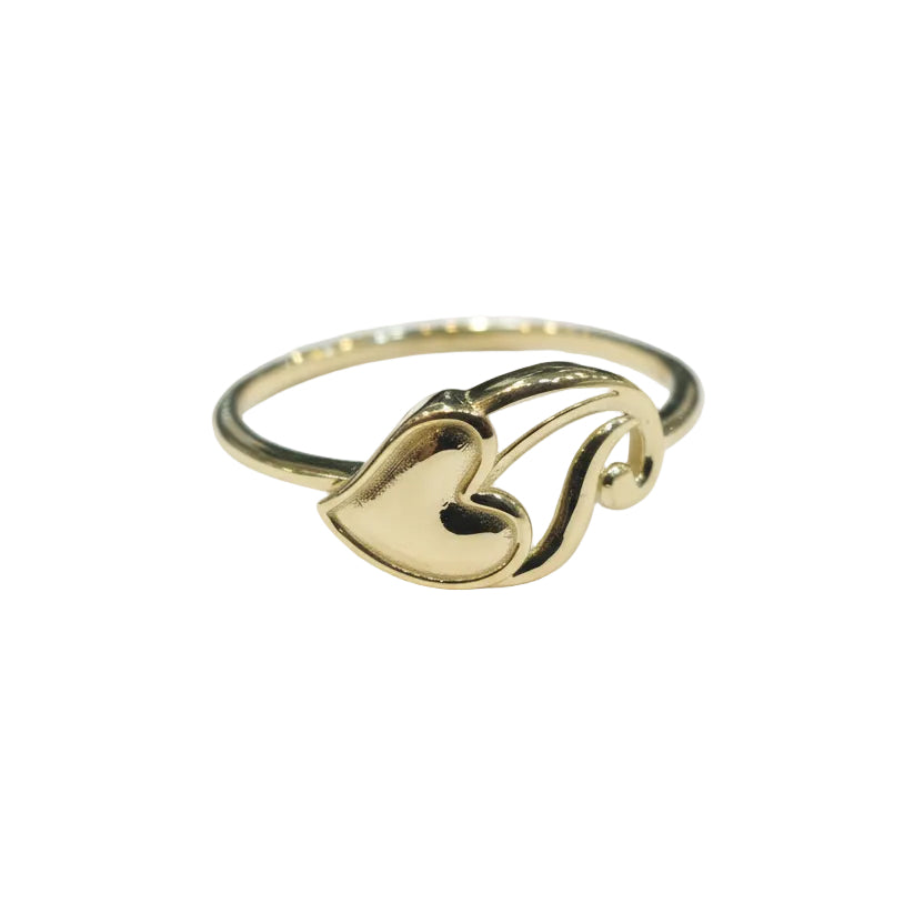 Gold ring with a heart design on a gray background
