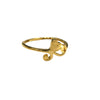 Gold ring with heart design on a gray background