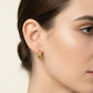 Gold hoop earrings on a gray background with weight and code information.