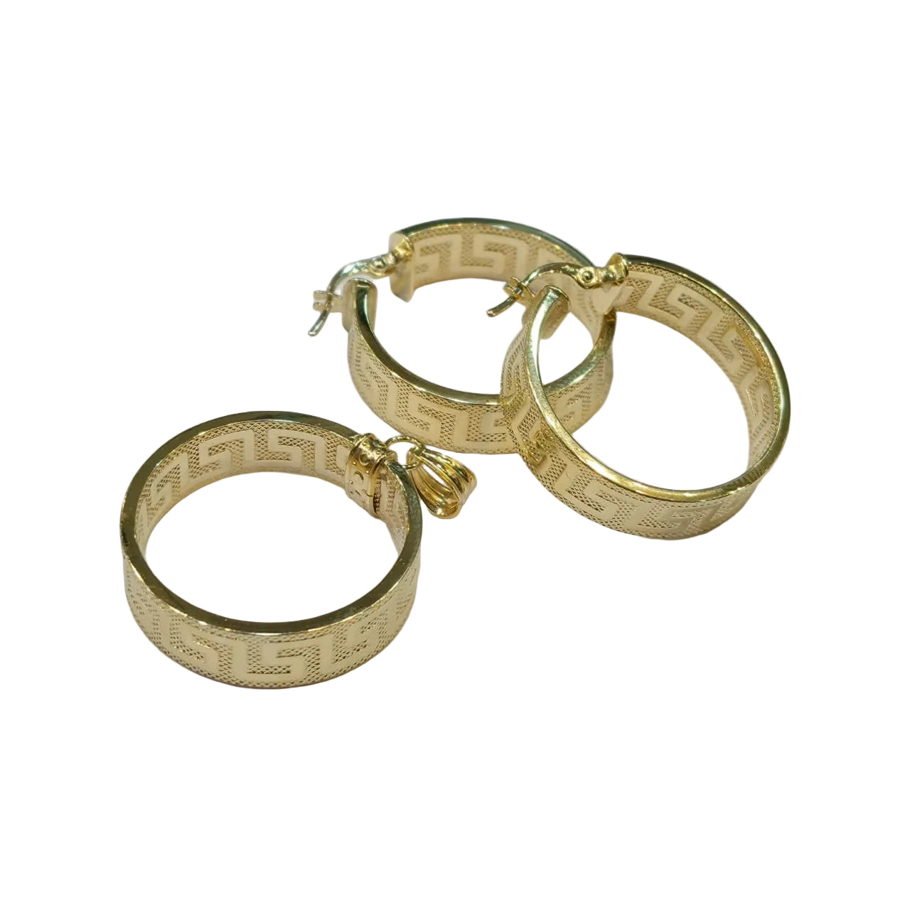 Gold hoop earrings with engraved design on a light gray background