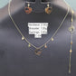 Jewelry set with necklace, bracelet, and earrings on a dark gray background