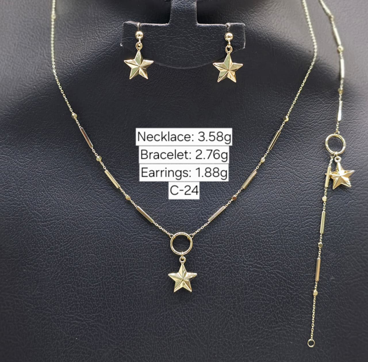 Jewelry set with necklace, bracelet, and earrings on a black background