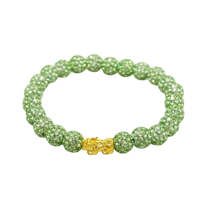 Green beaded bracelet with a gold clasp on a white background